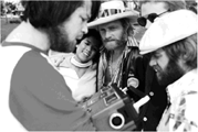 Boys around boombox: Brian with box, Mike Love, and Al Jardine